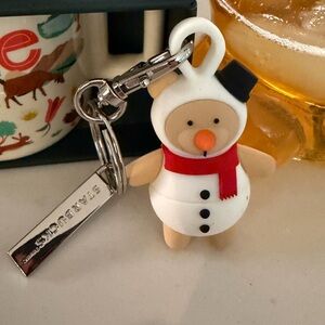 Starbucks Festive Snowman Keychain featuring cup stopper